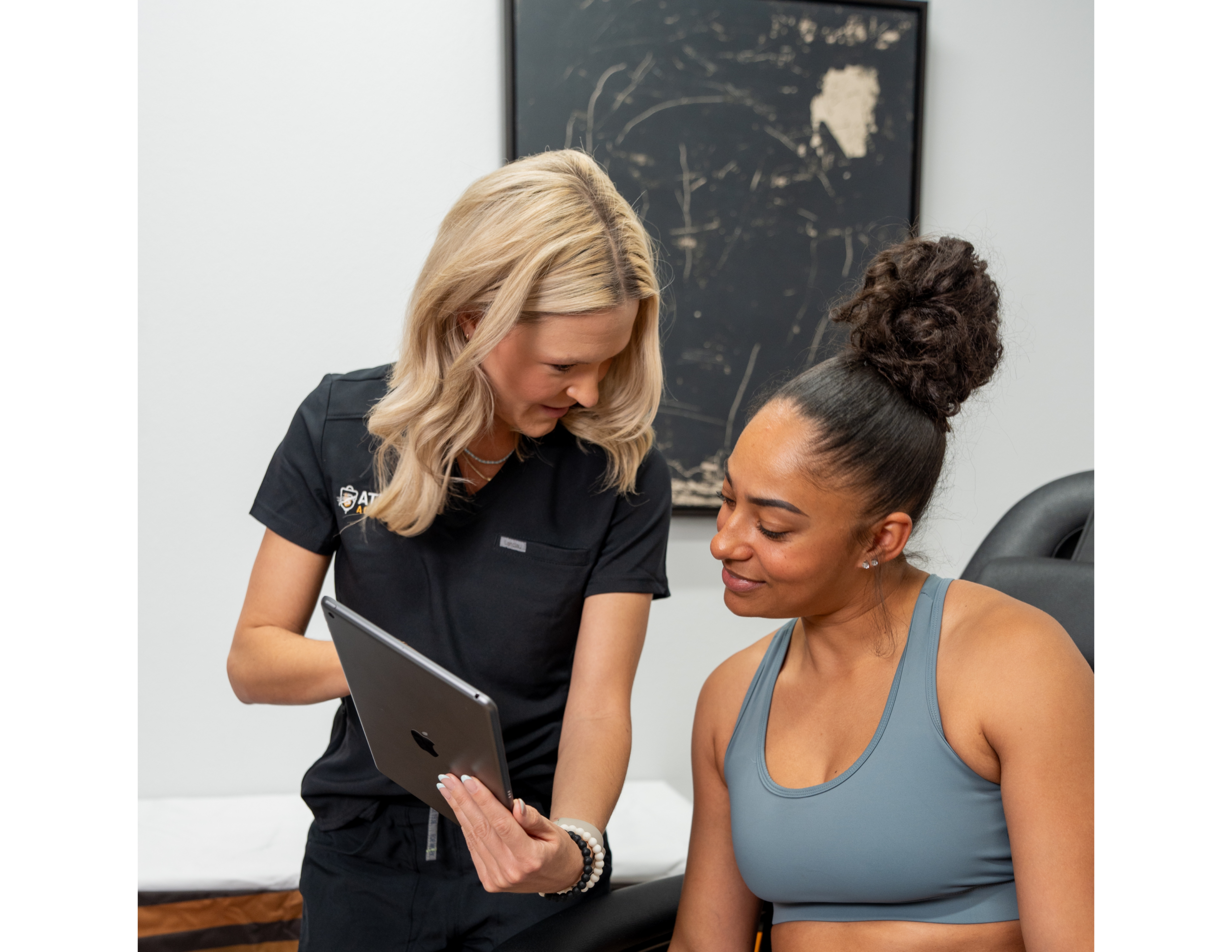 Healthcare professional showing tablet to client