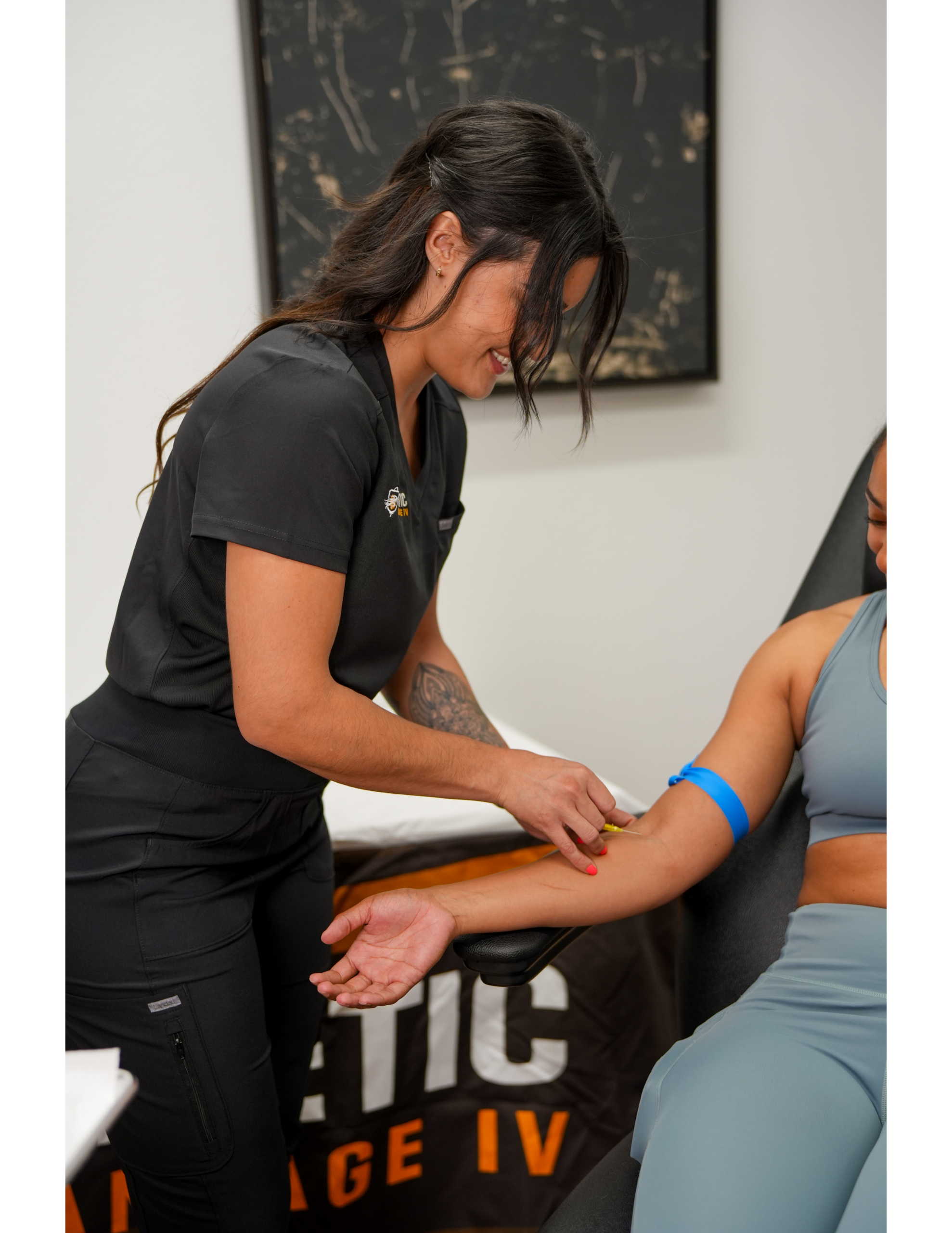 Healthcare worker preparing arm for blood draw