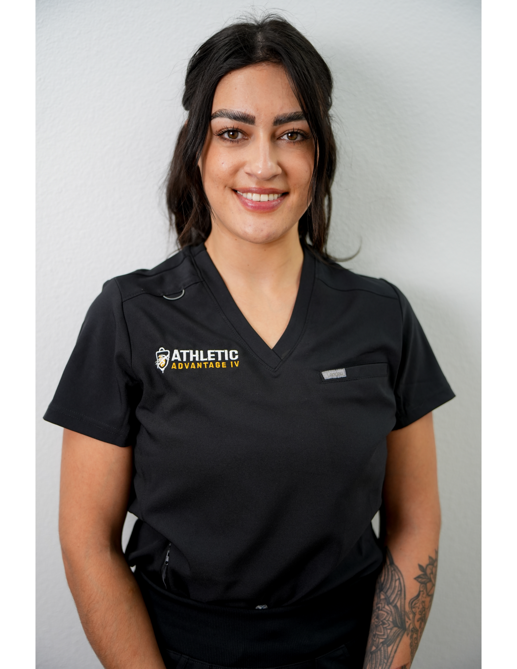 Smiling healthcare worker wearing black scrubs